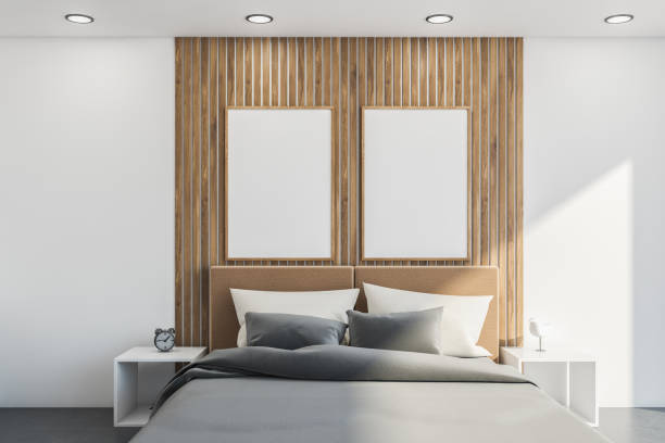 istock White bedroom with wood details. Two mockup posters 1333087855