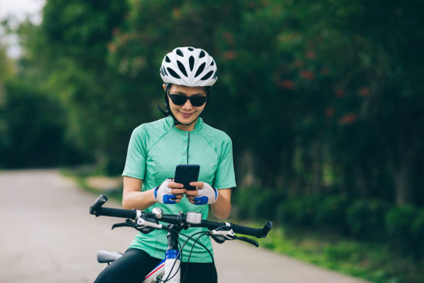 istock Cyclist use smartphone for navigation when riding mountain bike on forest trail 1333088926
