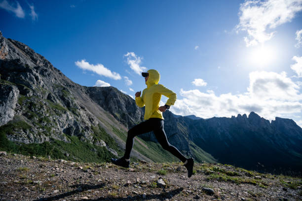 istock Young woman ultramarathon runner running at mountain top 1333092061