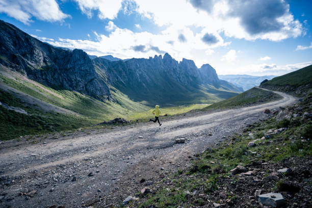 istock Young woman ultramarathon runner running at mountain top 1333092081