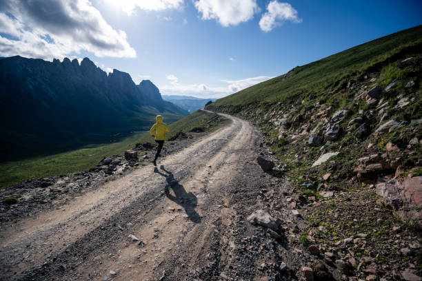 istock Young woman ultramarathon runner running at mountain top 1333092111