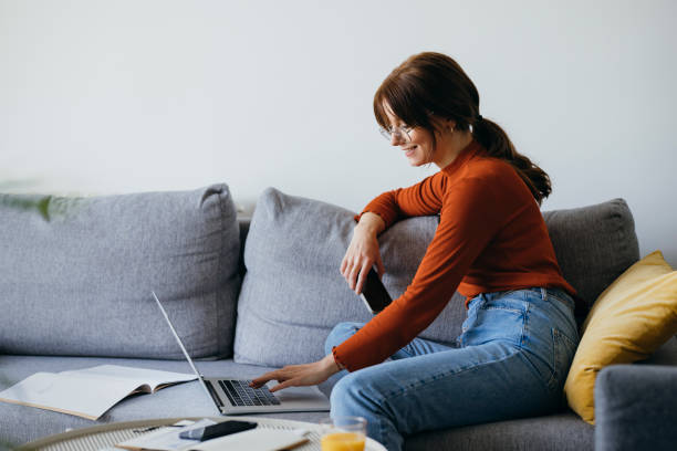istock Cheerful Business Woman Using Laptop Computer at Home 1333092716