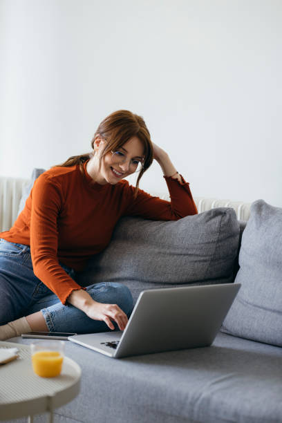istock Cheerful Business Woman Using Laptop Computer at Home 1333092730