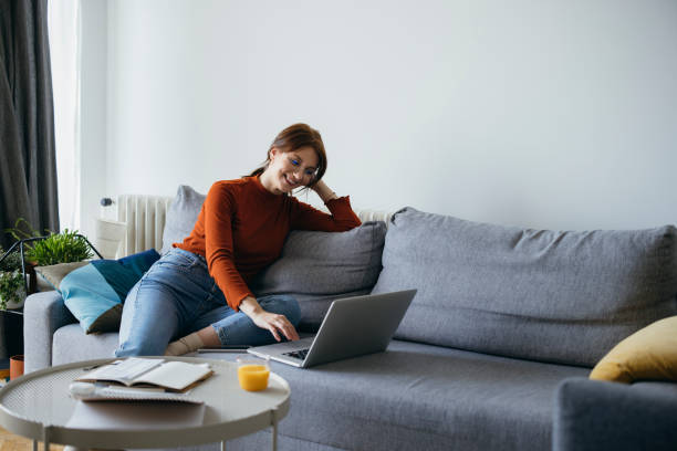 istock Smiling Business Woman Using Laptop Computer at Home 1333092743