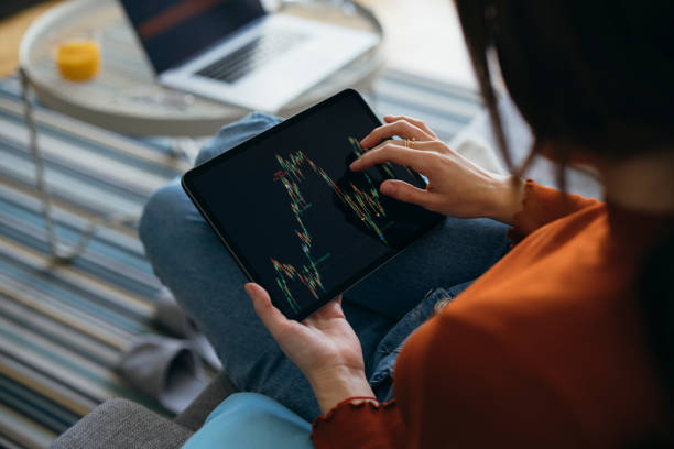 istock Unrecognizable Business Woman Analyzing Graph on Digital Tablet at Home 1333092767