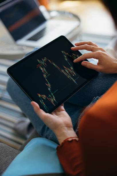 istock Unrecognizable Business Woman Analyzing Graph on Digital Tablet at Home 1333092771