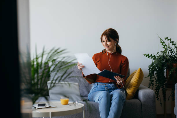 istock Beautiful Woman Using Digital Tablet at Home 1333092779