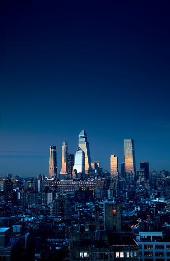 Dusk reflections from Hudson Yards skyscrapers in New York City.