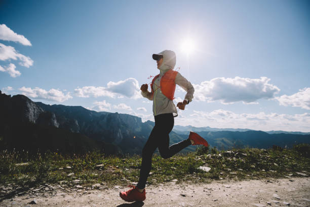 istock Young woman ultramarathon runner running at mountain top 1333096066