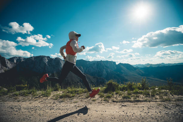 istock Young woman ultramarathon runner running at mountain top 1333096159