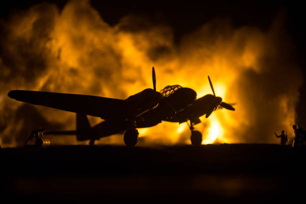 istock German Junker (Ju-88) night bomber at night. Artwork decoration with scale model of jet-propelled plane in possession. Toned foggy background with light. War scene. 1333096315