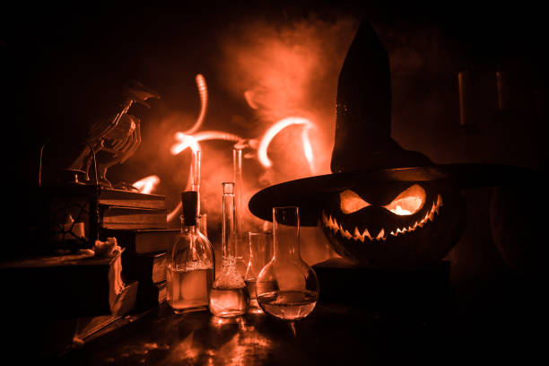 istock Halloween still-life background with different elements on dark toned foggy background. Selective focus 1333096329