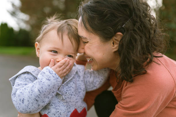 istock Hawaiian Mother Interacting With Her Happy Baby Outside 1333100945