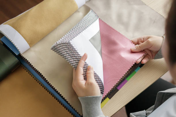 istock female designer with fabric color samples choosing textile for curtains 1333100982