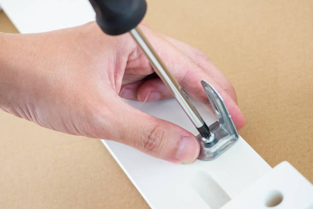 istock Assembly furniture using screwdriver at home 1333100993
