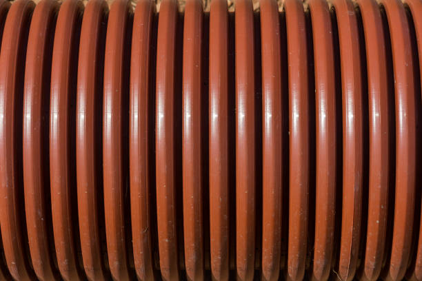 istock Plastic water pipe. The background is on the surface of the pipe. 1333101081