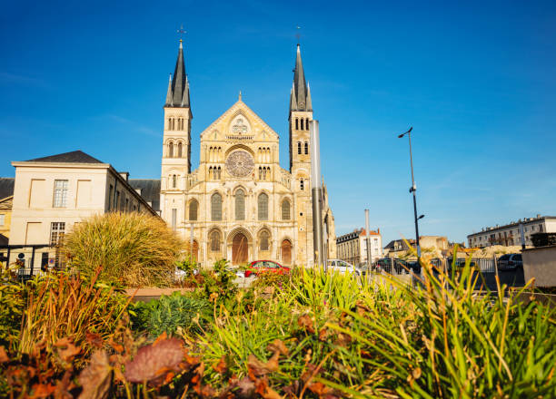 Basilica of St. Remi and Place du Chanoine Ladame Basilique Saint-Remi and place du Chanoine Ladame square over flowers ardennes department france stock pictures, royalty-free photos & images