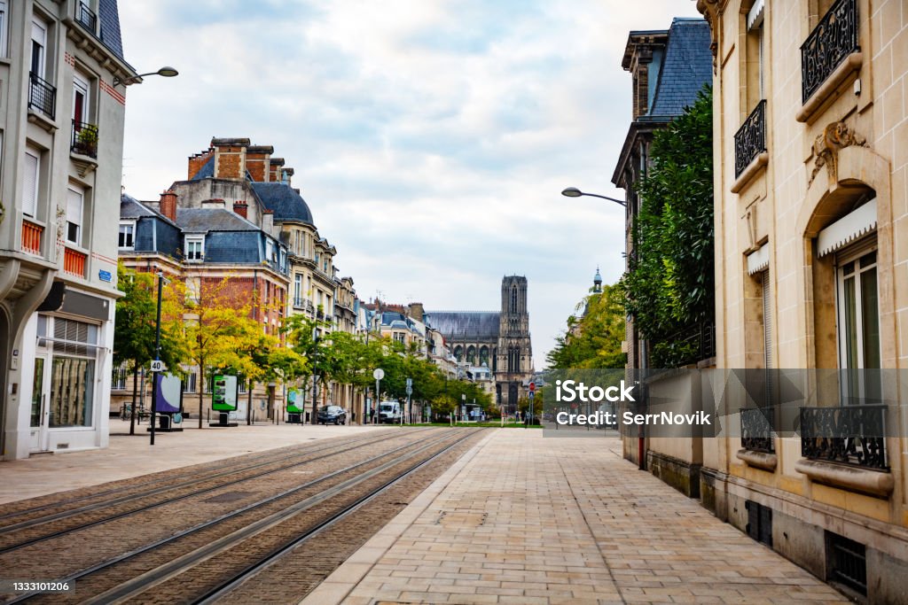 Cours Jean-Baptiste Langlet with tram lines, Reims Cours Jean-Baptiste Langlet street and tram lines in direction to Cathedral Notre-Dame de Reims Street Stock Photo