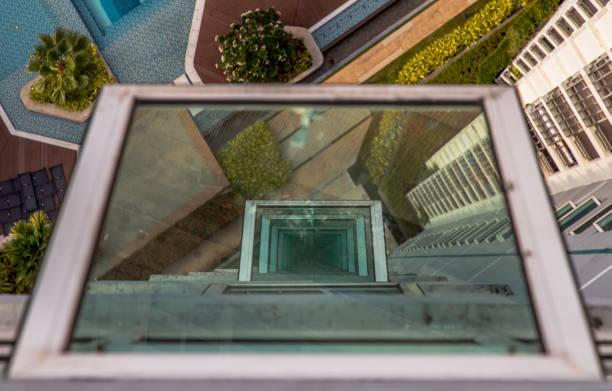 istock Reflection glass windows see through from above balcony at condominium during the daytime. 1333102318