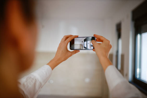 istock Real estate agent making final preparations before the meeting, photographing the place 1333102930