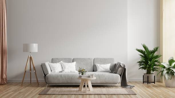 istock Living room interior wall mockup with sofa with decor on white background. 1333111970