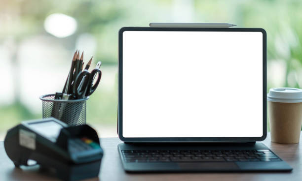 istock laptop blank screen with EDC machine on a table in a coffee shop 1333113648