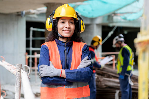 istock Afro female construction worker looks at the camera that portrays her 1333115475