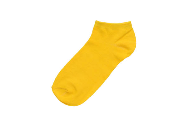 Yellow short sock isolated on a white background. Flat lay.