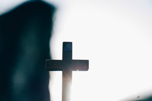 wooden cross and flowers