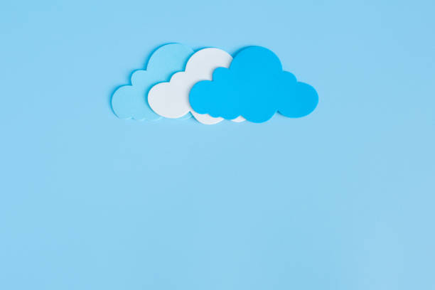 istock Light blue, white and blue paper cut clouds on blue background with copy space 1333117283