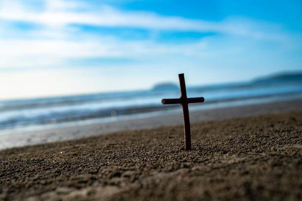 istock The wooden cross on the beach 1333117996