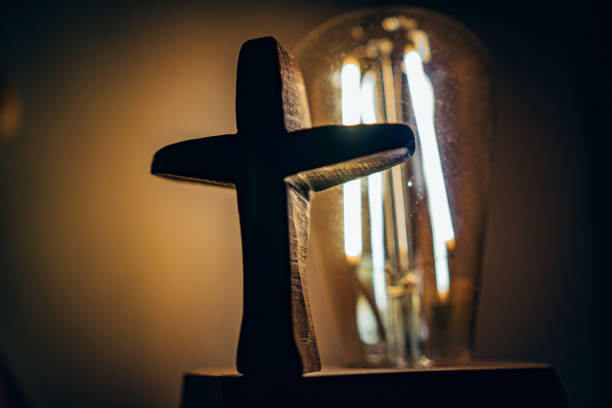 istock advance to the light and Wooden Cross. 1333118601