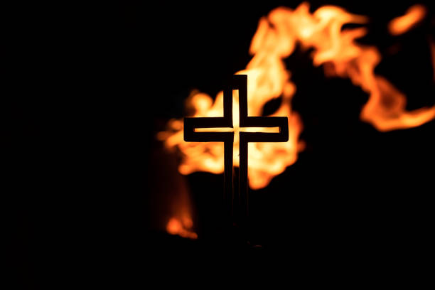 istock Into the flames,Wooden Cross 1333118765