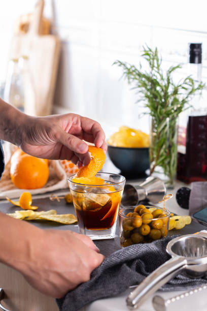 istock Mixologist making refreshing cocktail with vermouth at home 1333120294