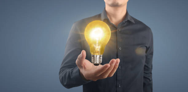 istock Hand of holding illuminated light bulb,  innovation inspiration concept 1333120980