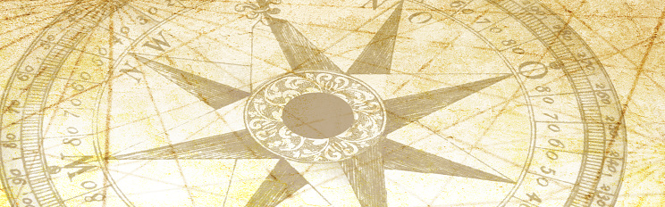 A compass on a map with navigational lines.