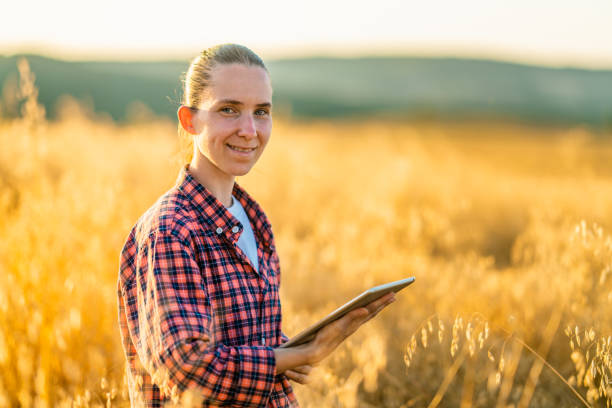 istock Female farmer holding digital tablet in farm field 1333123390