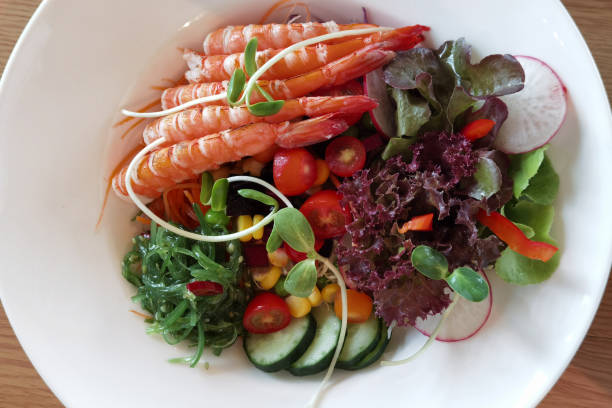 istock Fresh salad plate with shrimp, tomato and mixed greens 1333127540
