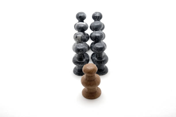 White pawn leads army of black pawns in a line