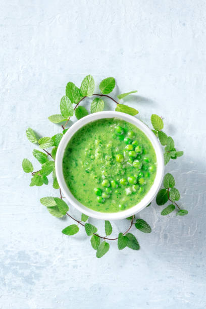 istock Vegan green soup with mint in a deep plate, shot from the top 1333132487