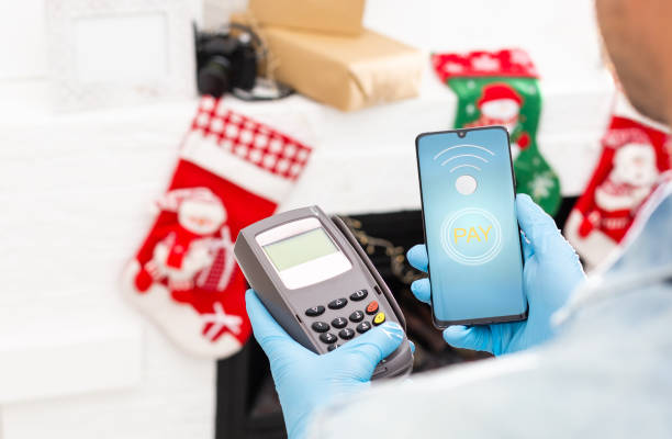 istock Contactless mobile payment. Payment terminal and smartphone in hands 1333134488
