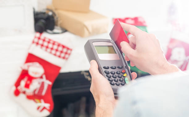 istock Payment on a trade through contactless card and NFC technology. Front view. Horizontal composition. 1333134839