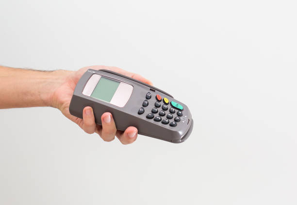 istock Payment on a trade through contactless card and NFC technology. Front view. Horizontal composition. 1333134983