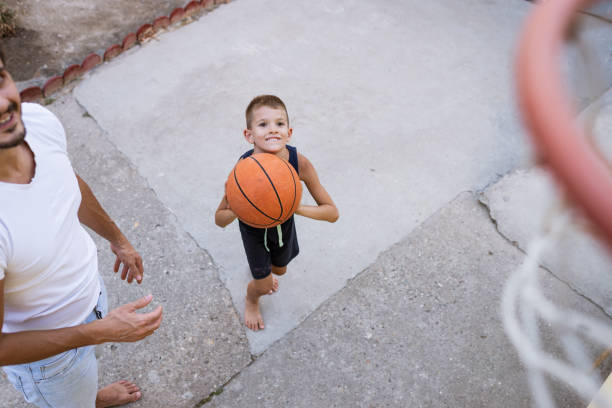 istock Father and son playing basketball 1333135013