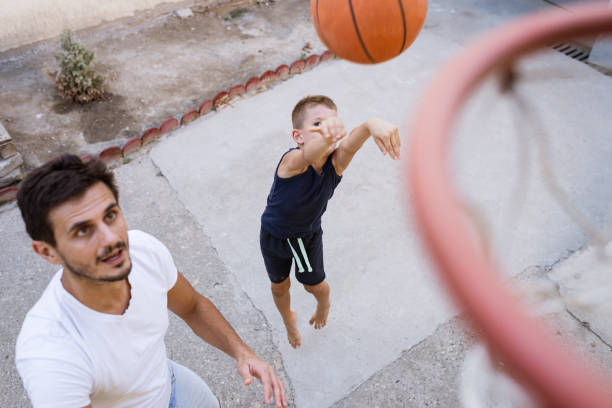 istock Father and son playing basketball 1333135039