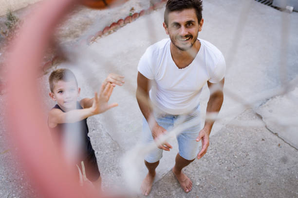 istock Father and son playing basketball 1333135059