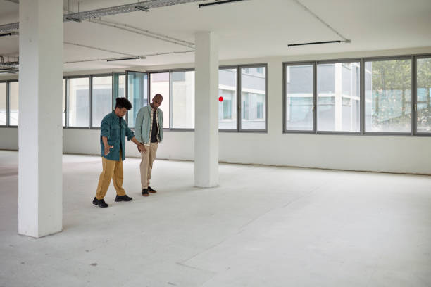 istock Commercial Real Estate Broker and Client Imagining Potential 1333137227