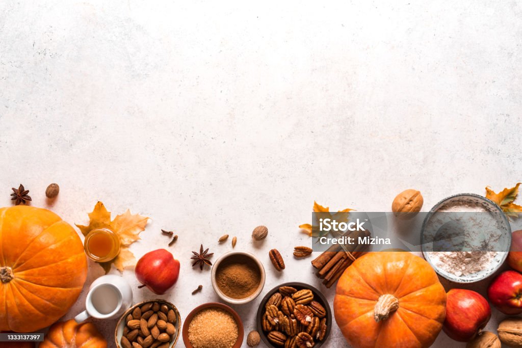 Autumnal fall baking background Autumnal fall baking background with apples, pumpking, nuts and seasonal spices for cooking apple or pumpking pie. Thanksgiving and cozy autumn holidays concept. Thanksgiving - Holiday Stock Photo