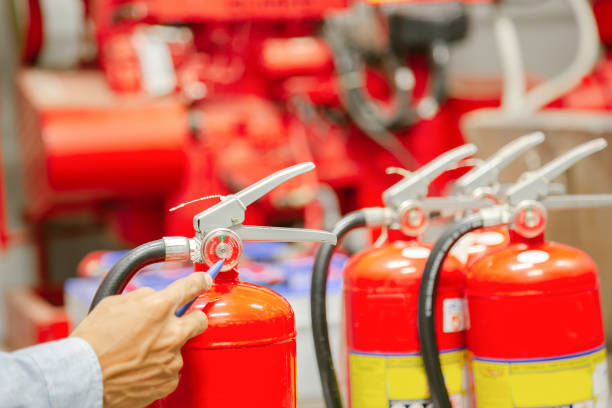 istock Engineer inspection Fire extinguisher and fire hose,Ready to use in the event of a fire.Safety first concept. 1333138269