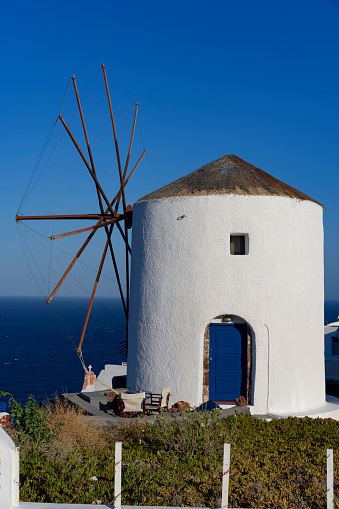 View of famous windmill in Oia, Santorini, Greece
